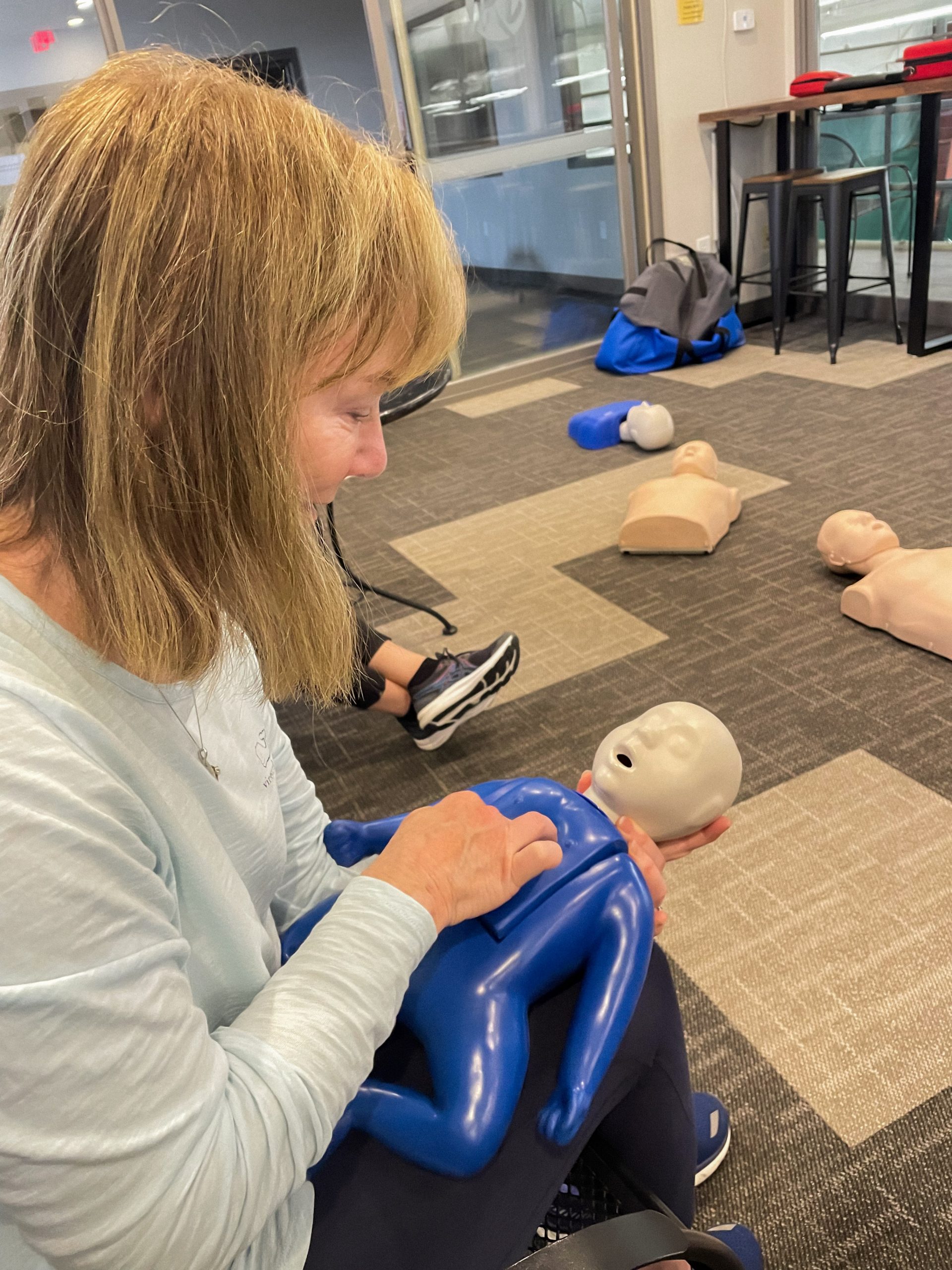 IRC Pro Debbie Carlson practicing infant CPR